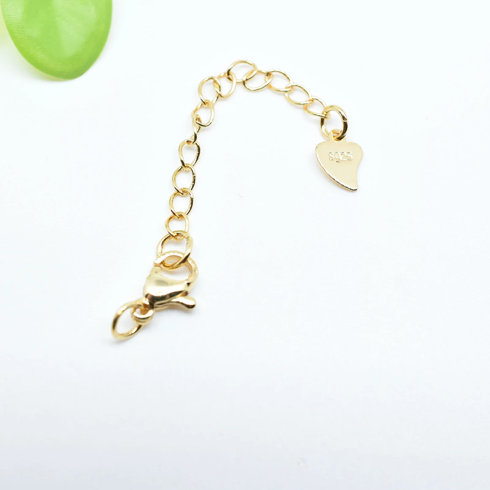 Gold-Tone Chain Extender with Heart Tag — main product photograph
